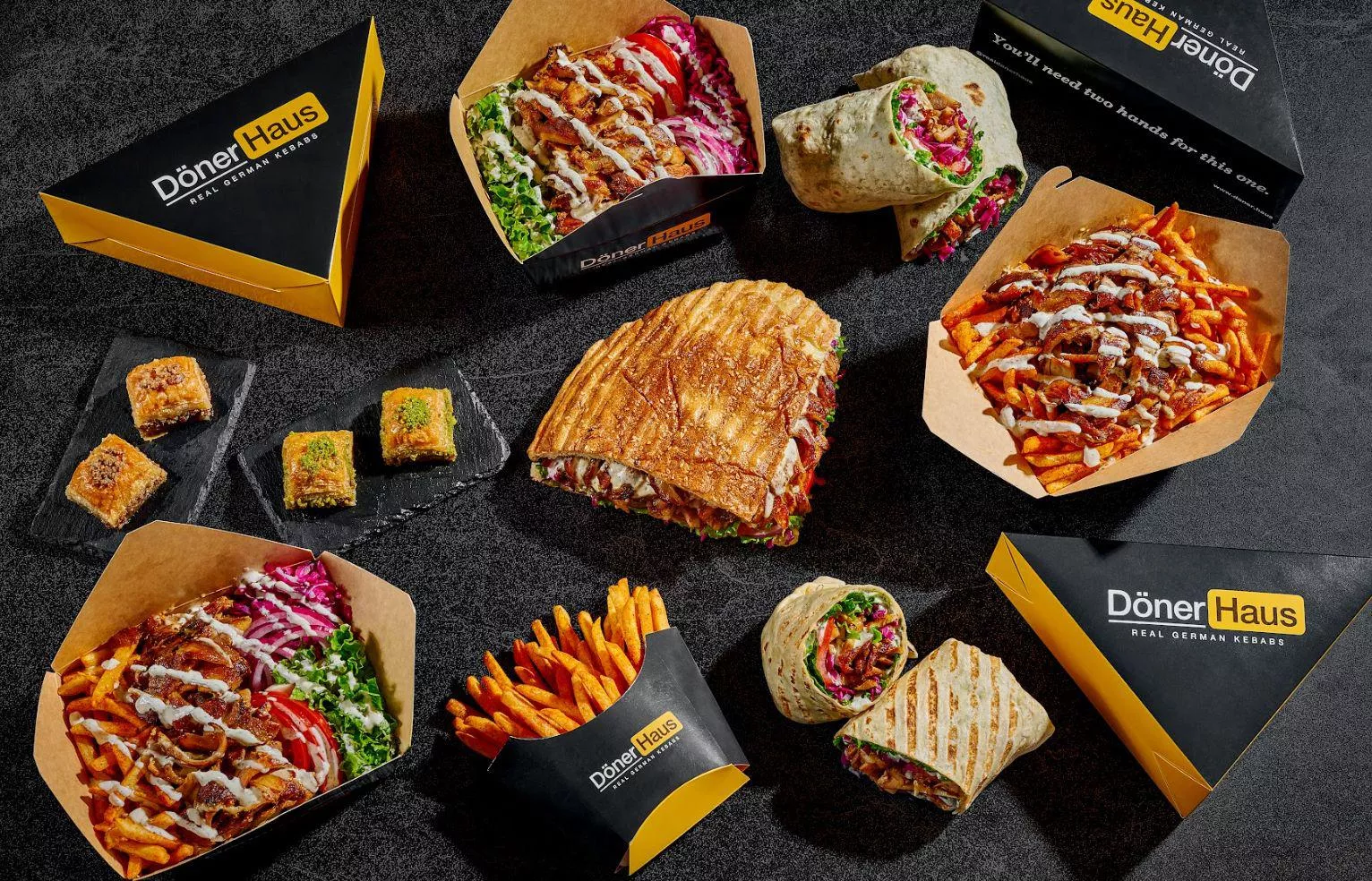 A Döner Haus sandwich, wrap, boxes and fries